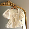 BEIGE BLOUSE MET POFMOUWEN