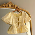 GELE BLOUSE MET POFMOUWEN