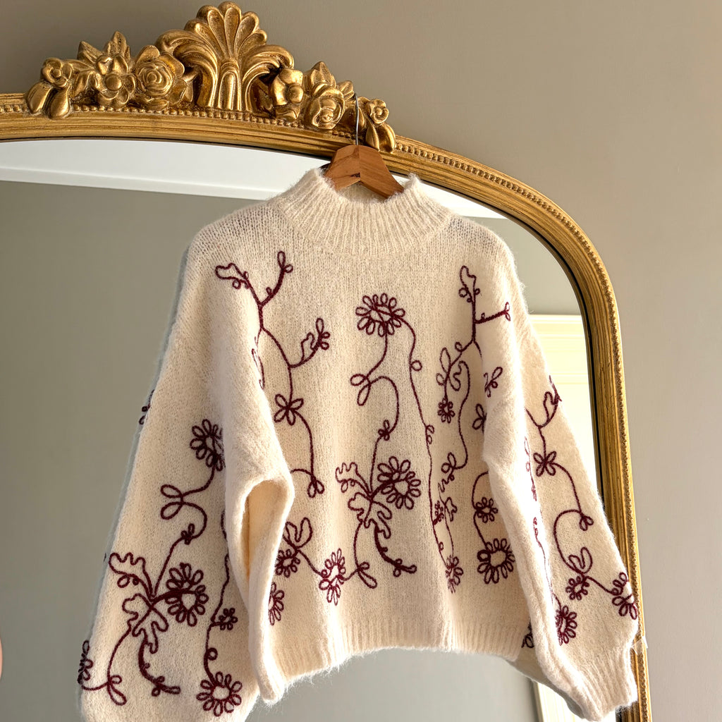 BEIGE TRUI GEBORDUURD